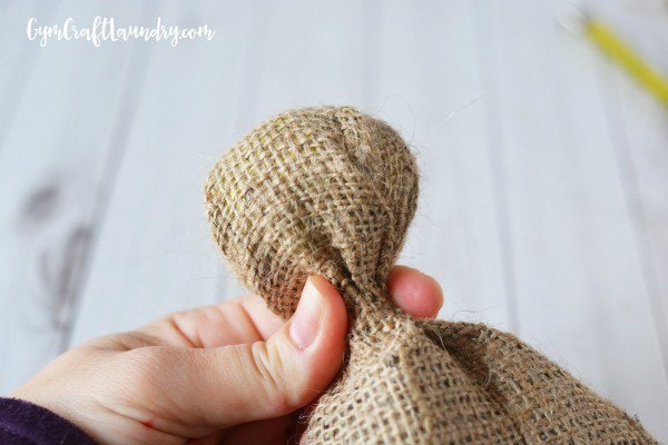How to form the head of the burlap angel ornament.