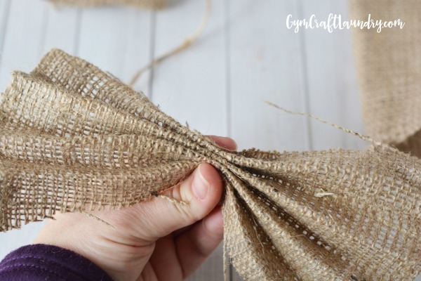 How to fold a piece of burlap ribbon to make a burlap angel ornament. 