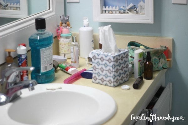 decluttering a messy bathroom 