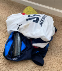 pile of dirty, stinky youth soccer uniforms